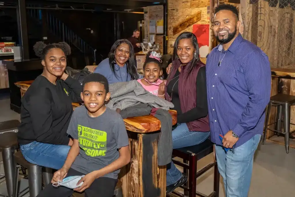 Family celebrating a birthday with axe throwing in Memphis