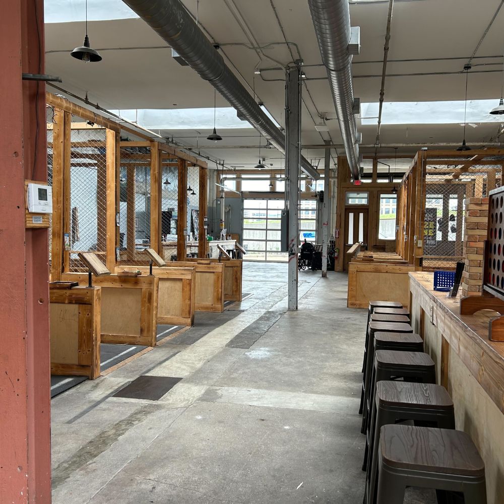 Indoor throwing lanes at Craft Axe Throwing Memphis with wooden targets