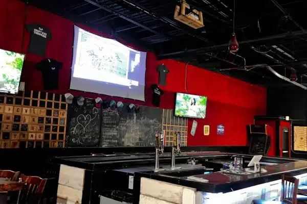Private upstairs bar with stools and a lounge area at the Craft Axe Throwing Columbia venue