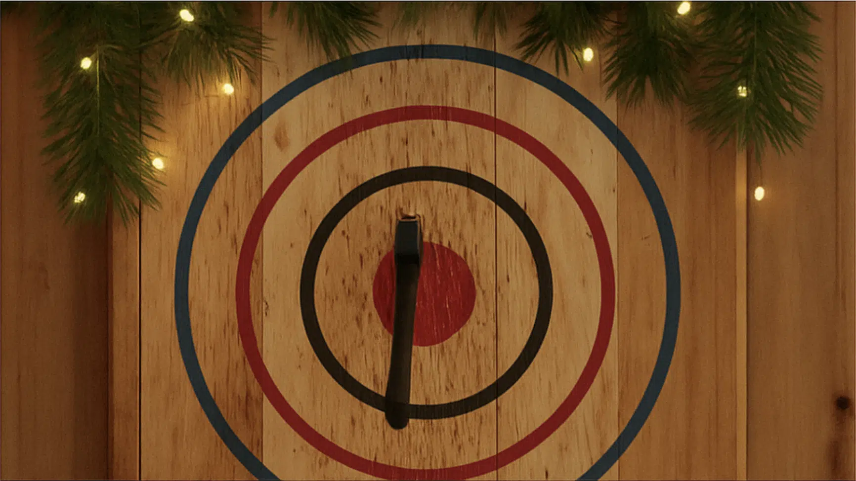 Axe throwing target decorated with a holiday wreath for the Christmas season